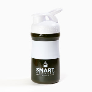 1  Smart Pressed Juice white water jug filled with green smoothie inside against a white background.